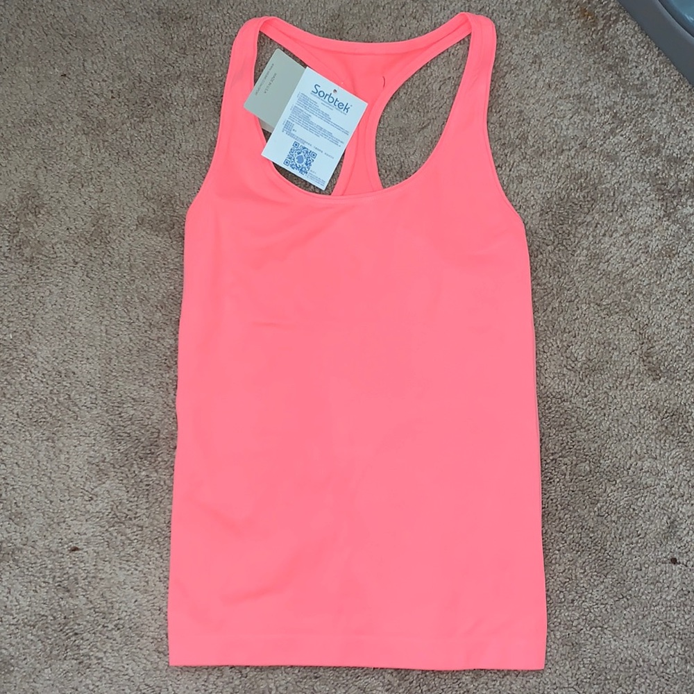 6️⃣ Nikibiki Racerback tank top S/M NWT coral peach